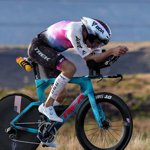 Sam Long racing wearing the Elite Aero Calf Sleeves - White